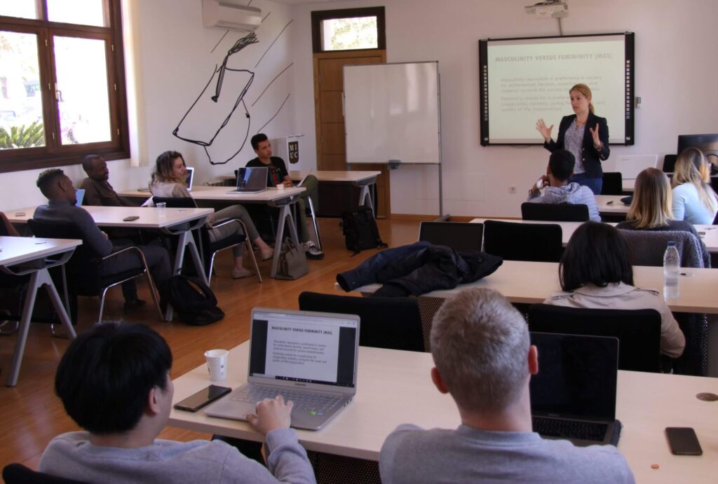 A lecturer teaching students in a classroom at MIUC.