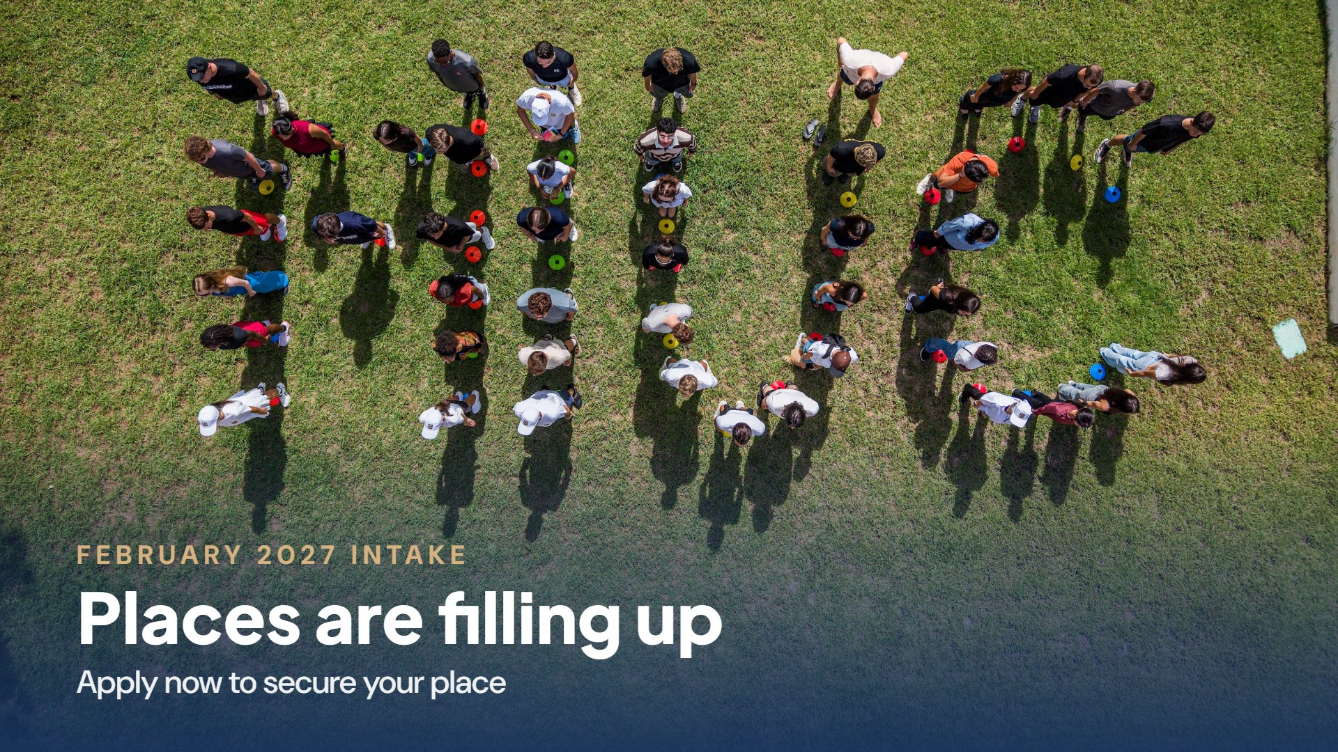 MIUC students spelling out MIUC on the campus lawn, seen from above